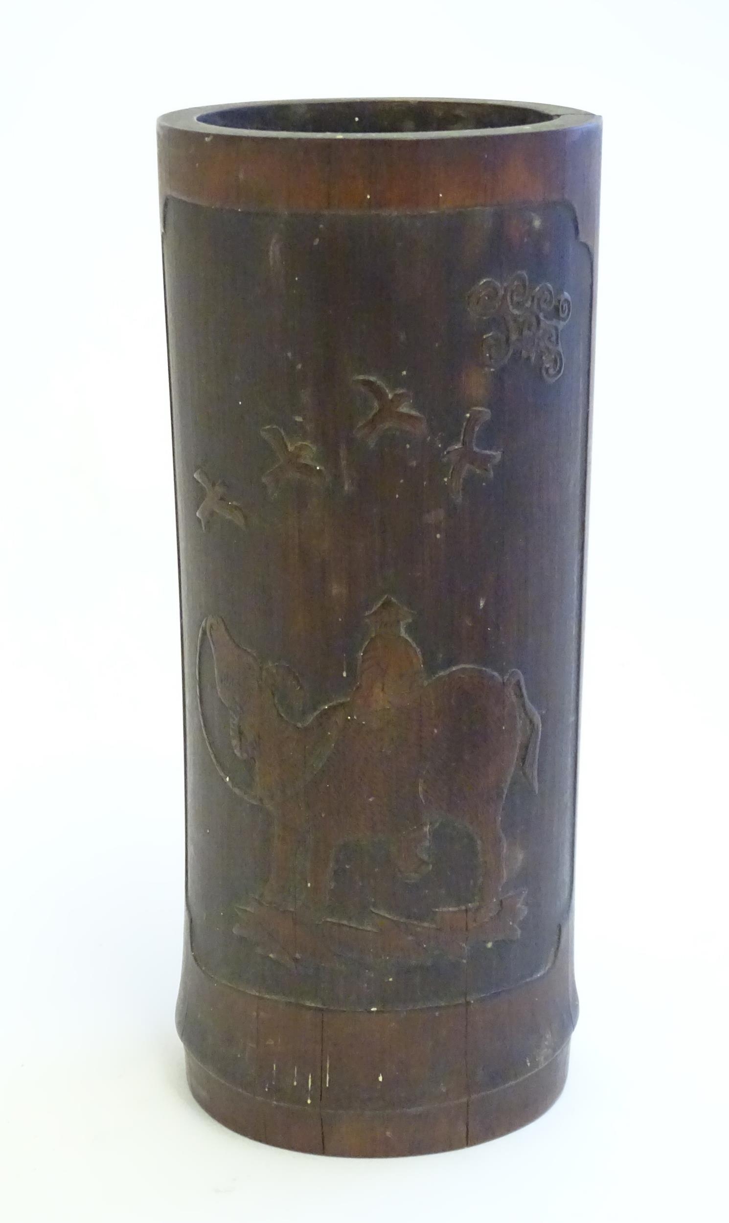 An Oriental carved bamboo vase depicting a figure on a water buffalo with birds. Approx. 10" high - Image 3 of 6