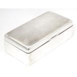 A silver cigarette box of rectangular form, hallmarked Birmingham 1931, maker Wilmot Manufacturing