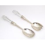 A pair of silver salad servers with cut glass handles, hallmarked Birmingham 1905, maker William