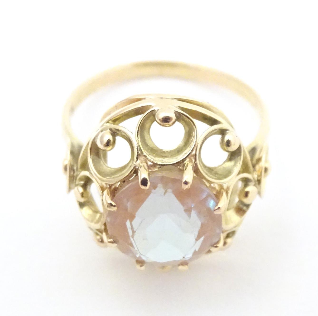 A Continental yellow metal ring set with facet saphiret glass to top. The ring approx size Q. Please - Image 4 of 7