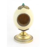 A late 19th / early 20thC mounted ostrich egg clock case in the manner of Anthony Redmile, with a