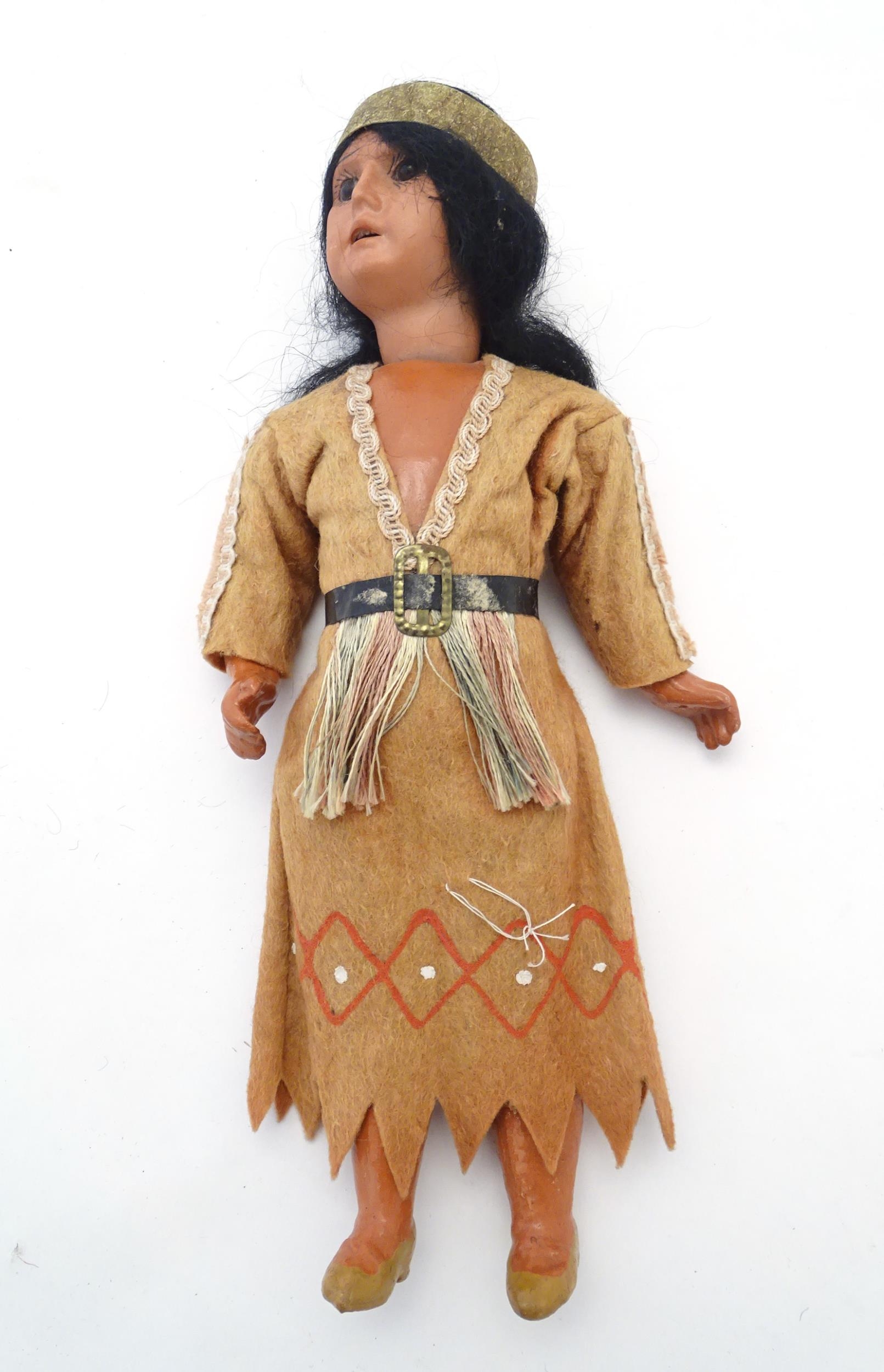 Toy: A 20thC Continental doll modelled as a Red Indian woman, possibly Pocahontas. With a bisque - Image 3 of 12