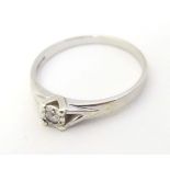 A 9ct white gold ring set with diamond solitaire. the ring approx size L Please Note - we do not