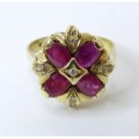 An 18ct gold ring set four ruby coloured spinel and nine diamonds. Ring size approx. O Please Note -