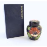 A limited edition Moorcroft ginger jar in the Anemone pattern. Marked under with impressed jug and