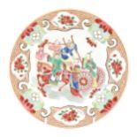 A Chinese famille rose plate decorated with figures and a horse and cart, bordered by flowers and