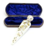 A Victorian scent / perfume bottle / flask with silver top and gilt floral detail hallmarked