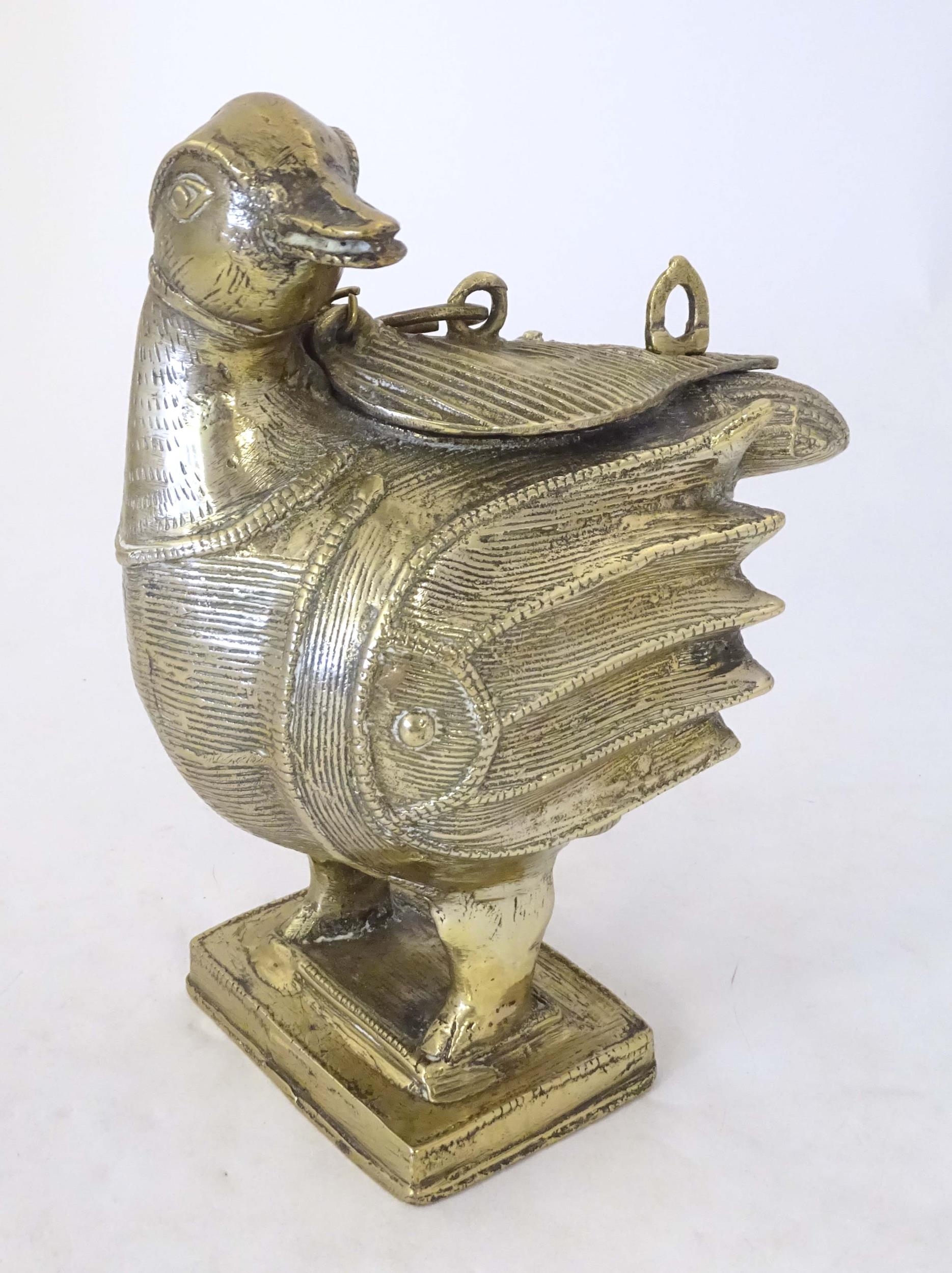 A late 19th / early 20thC Indian brass container modelled as a stylised duck with engraved