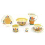 A quantity of Clarice Cliff early morning / breakfast wares in the Crocus pattern, comprising milk