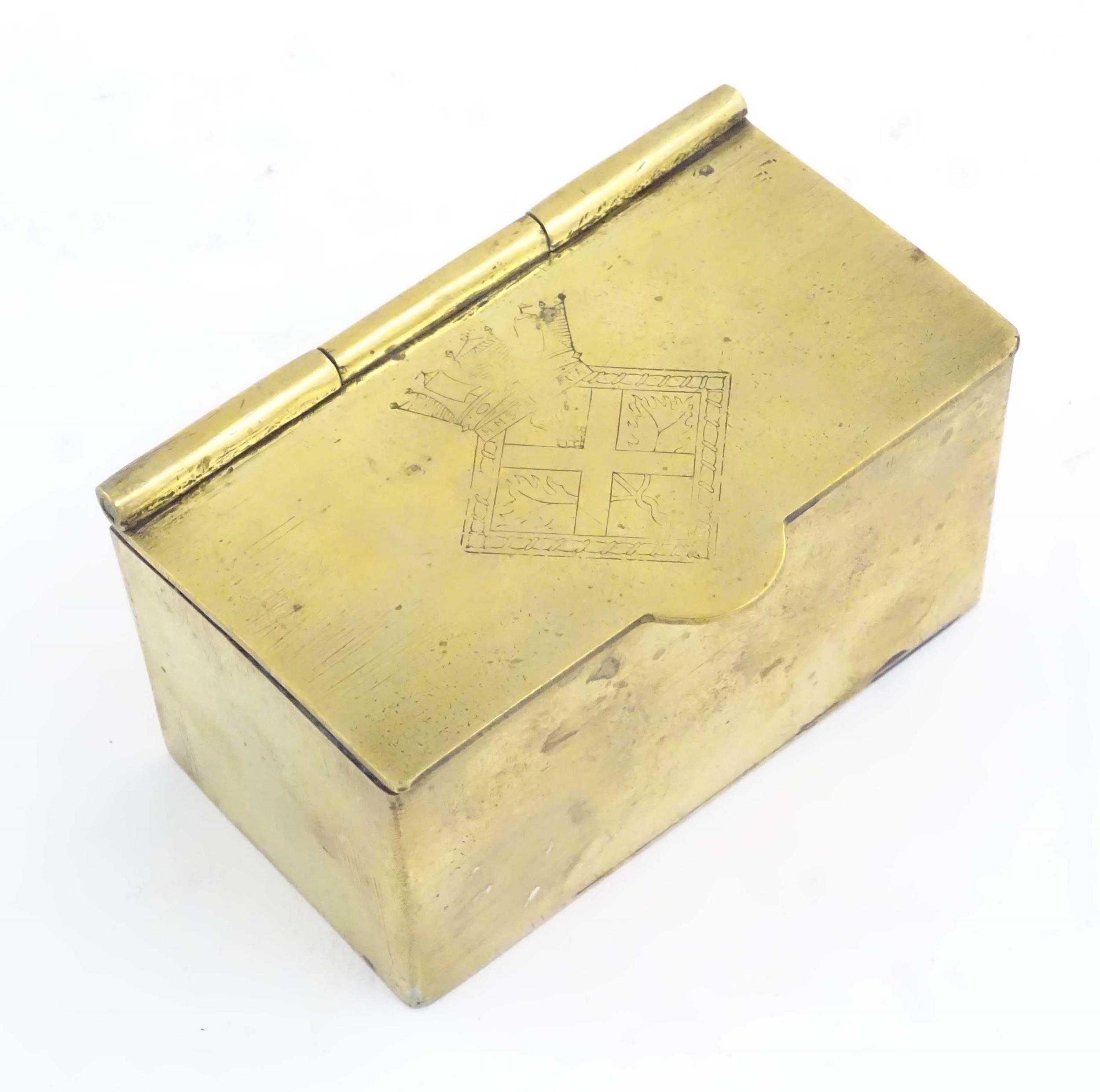 A mid 20thC brass tea caddy, the hinged lid decorated with the arms of HMS Caledonia (shore