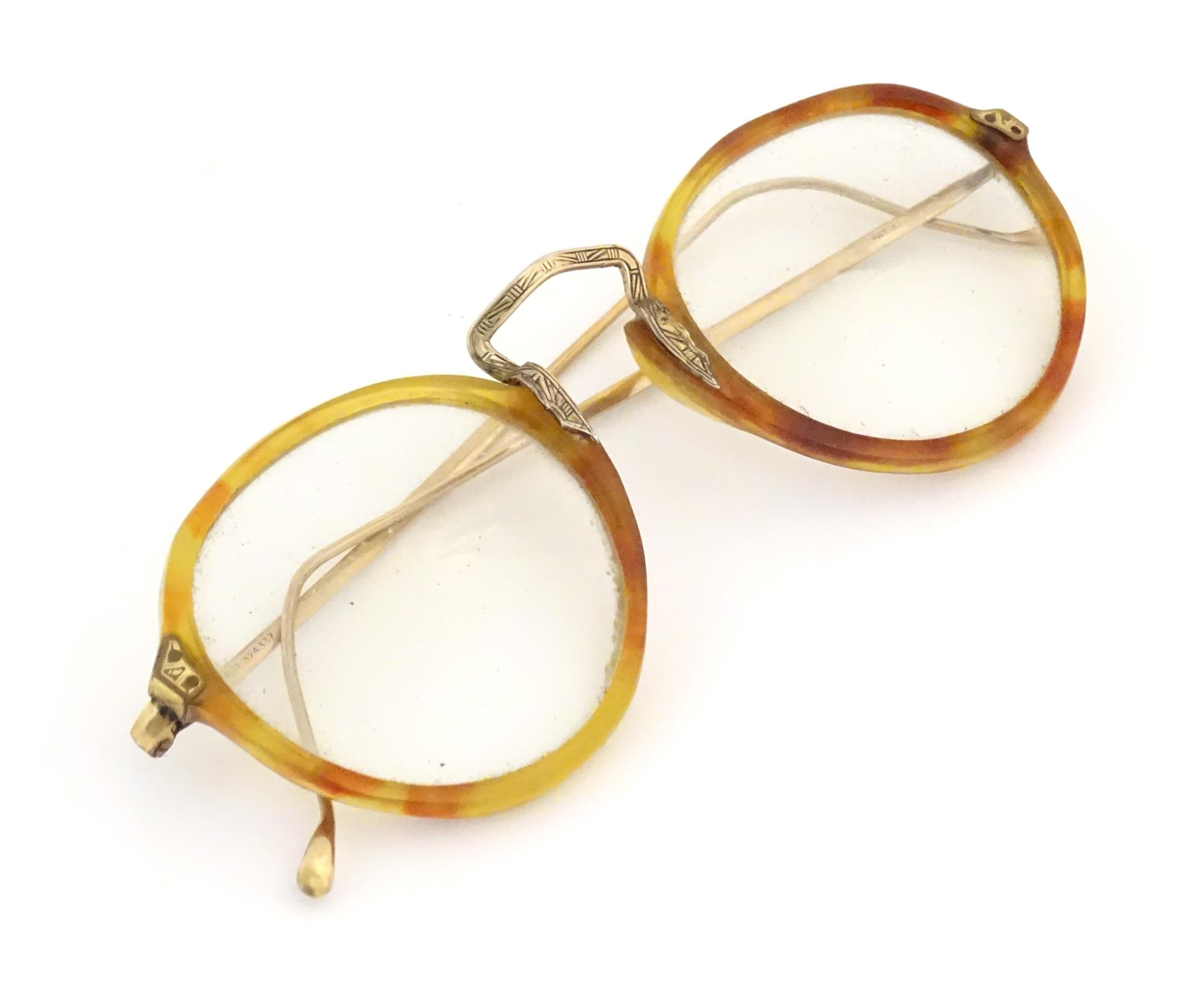 A cased pair of c1940s bifocal spectacles / glasses, with faux tortoiseshell and gilt metal - Image 10 of 11