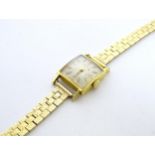 A ladies Convair wristwatch with 18ct gold case and 9ct gold strap. Squared dial approx. 3/4" wide