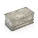 An early 20thC Chinese pewter lidded box of rectangular form with dragon decoration to top, the