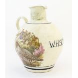 A mid 20thC large rustic stoneware Scottish pottery jug, decorated with illustrations of a pair of