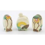 A Clarice Cliff three piece cruet set comprising salt, pepper and mustard pot, with floral