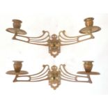 A pair of Art Nouveau brass twin branch piano candle sconces Approx 12" wide x 4 1/2" high (2)