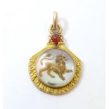 A c.1900Continental gold and yellow metal pendant / charm set with Essex crystal style cabochon to