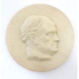 A 20thC Arabia ceramic roundel / plaque depicting a portrait of the Finnish composer Jean Sibelius