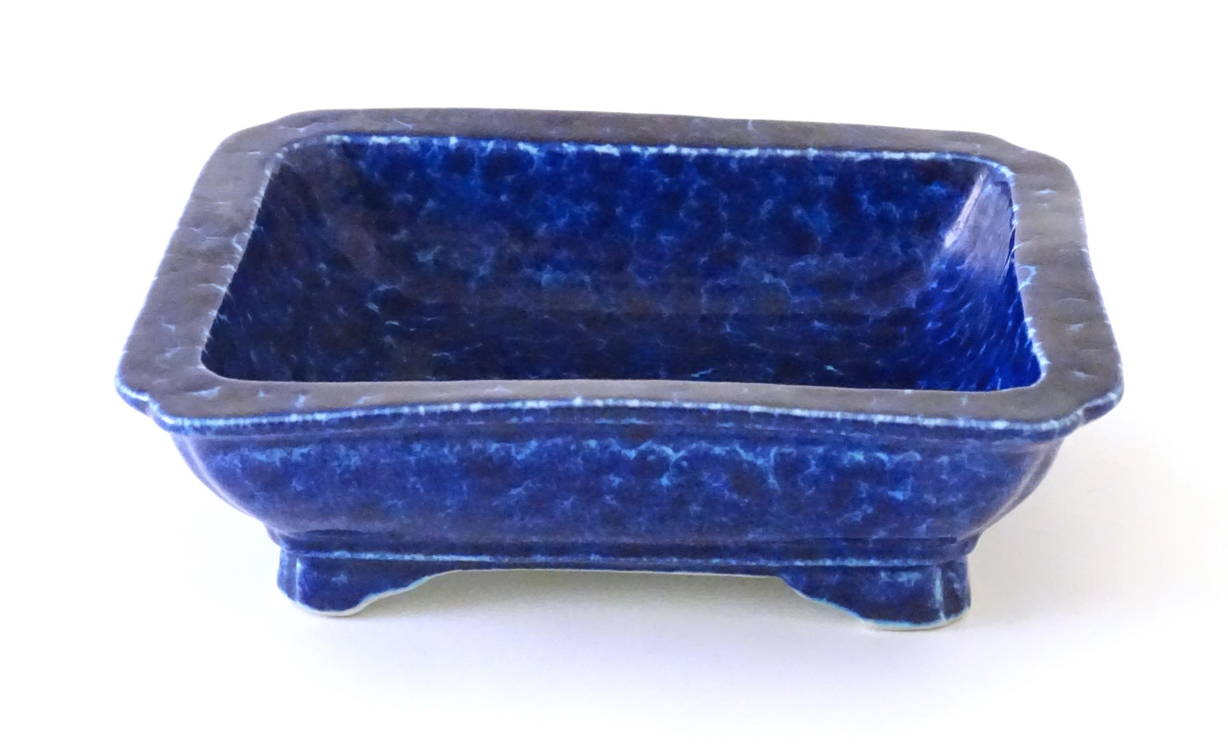 A Chinese dish of rectangular form with a blue glaze, raised on four feet. Character marks under. - Image 3 of 8