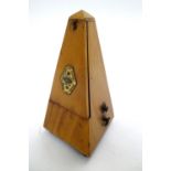 An early 20thC clockwork metronome, the pyramid case bearing brass plaque for 'Metronome Maelzel'