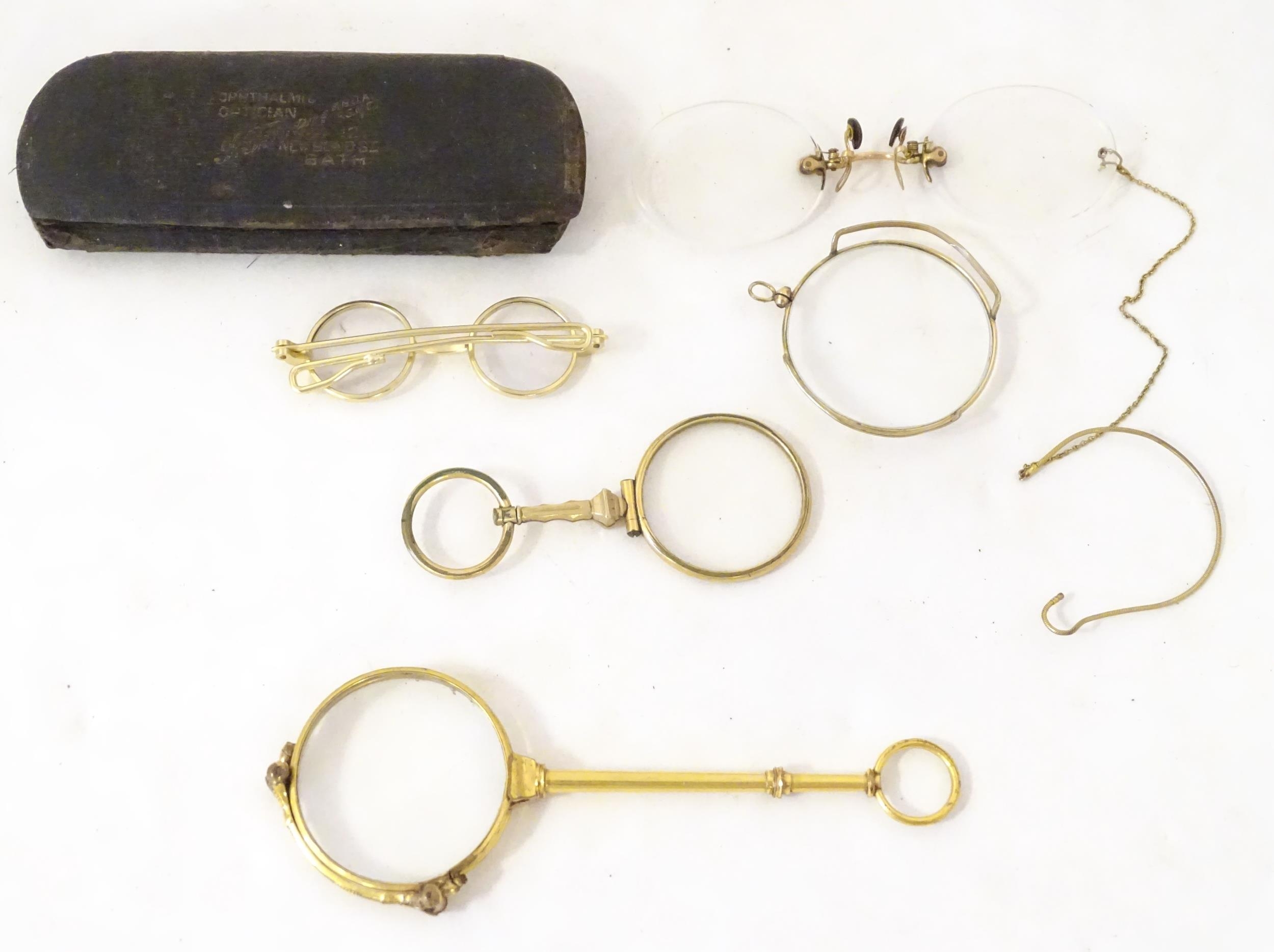 A quantity of late 19thC and later yellow metal pince nez, spectacles and monocles, the largest