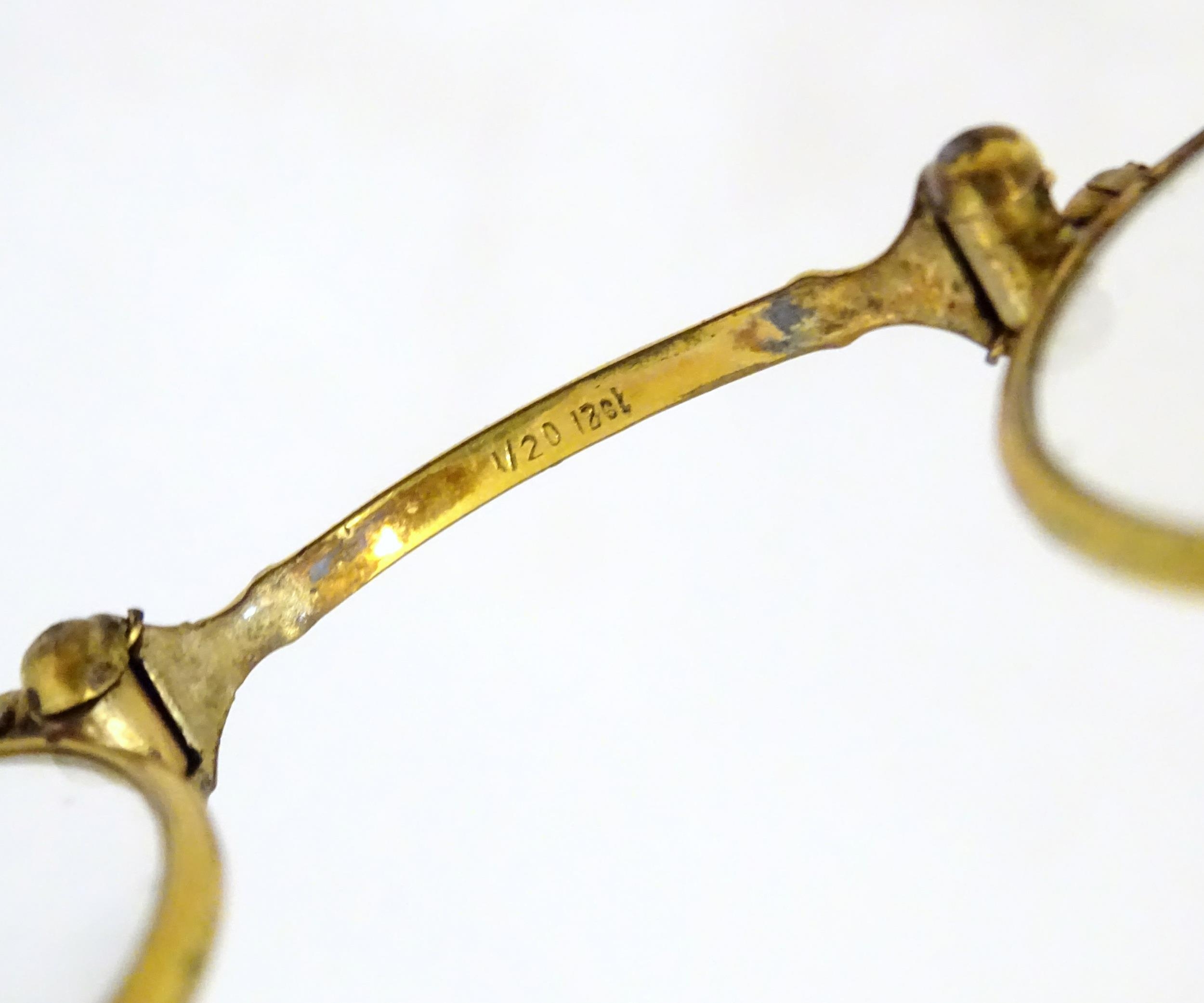 A quantity of late 19thC and later yellow metal pince nez, spectacles and monocles, the largest - Image 8 of 9