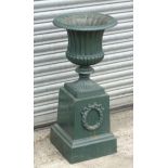 A 19thC painted cast iron pedestal garden jardiniere / planter of fluted urn form on a plinth base