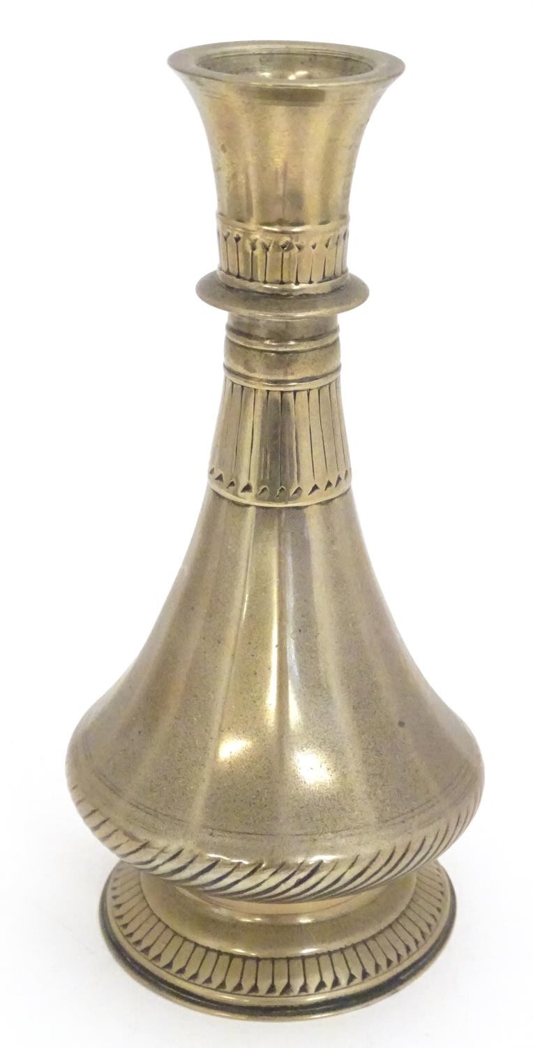 An 18th / 19thC Indian brass vase with engraved banded detail. Approx. 8 1/4" high Please Note -