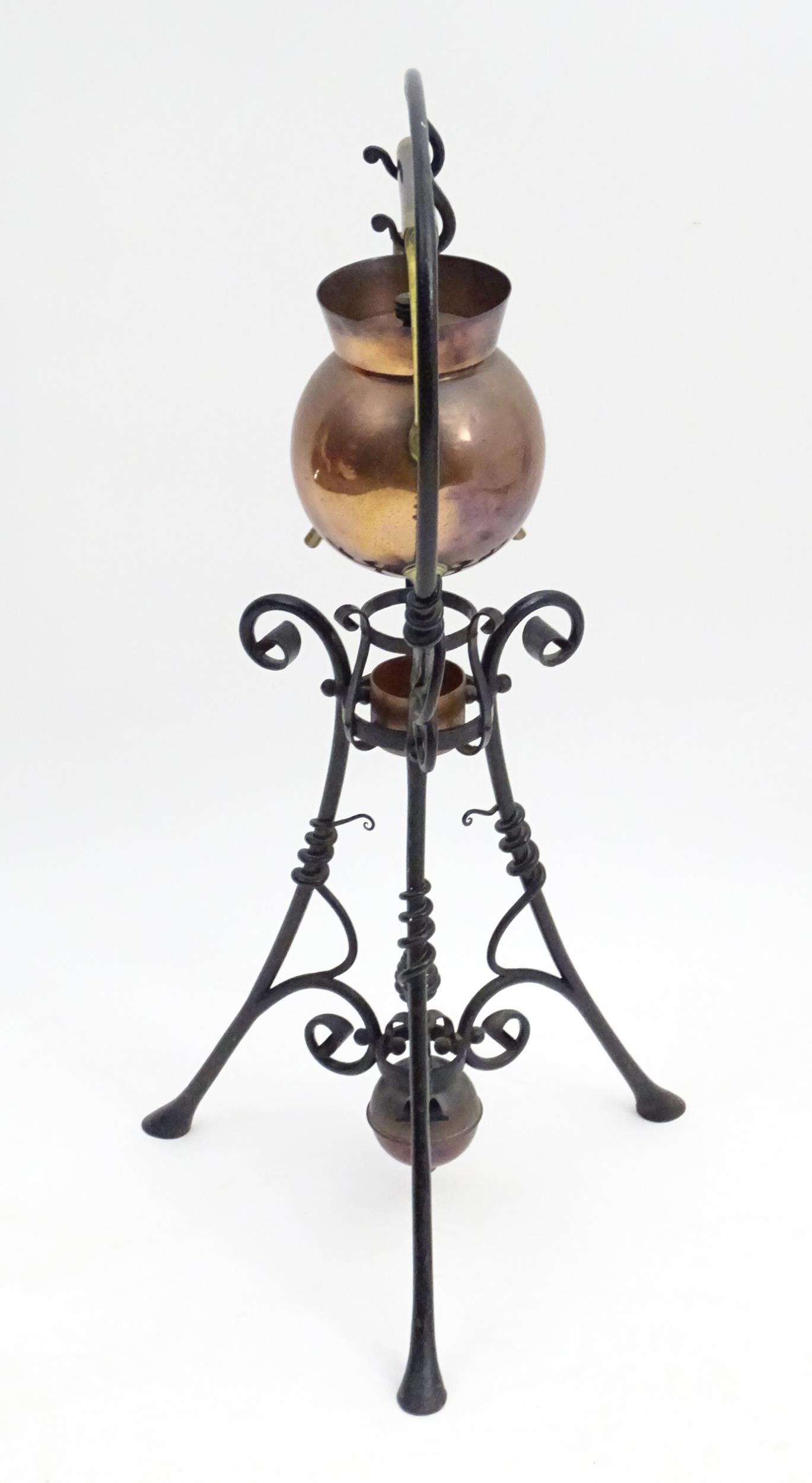 An Arts & Crafts copper and brass spirit kettle on a scrolling wrought iron stand designed by Dr - Image 13 of 20
