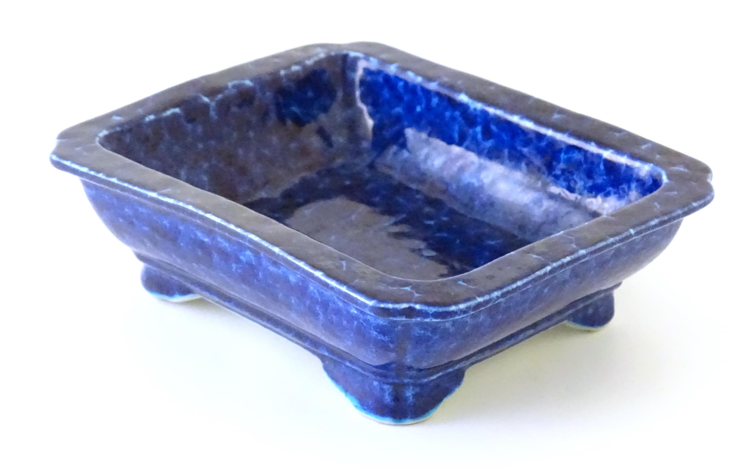 A Chinese dish of rectangular form with a blue glaze, raised on four feet. Character marks under. - Image 6 of 8