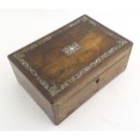 A Victorian rosewood writing slope with inlaid floral and foliate decoration and twin brass campaign