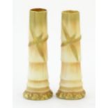 A pair of Royal Worcester spill vases with relief bamboo detail. Marked under with 1049. Approx.