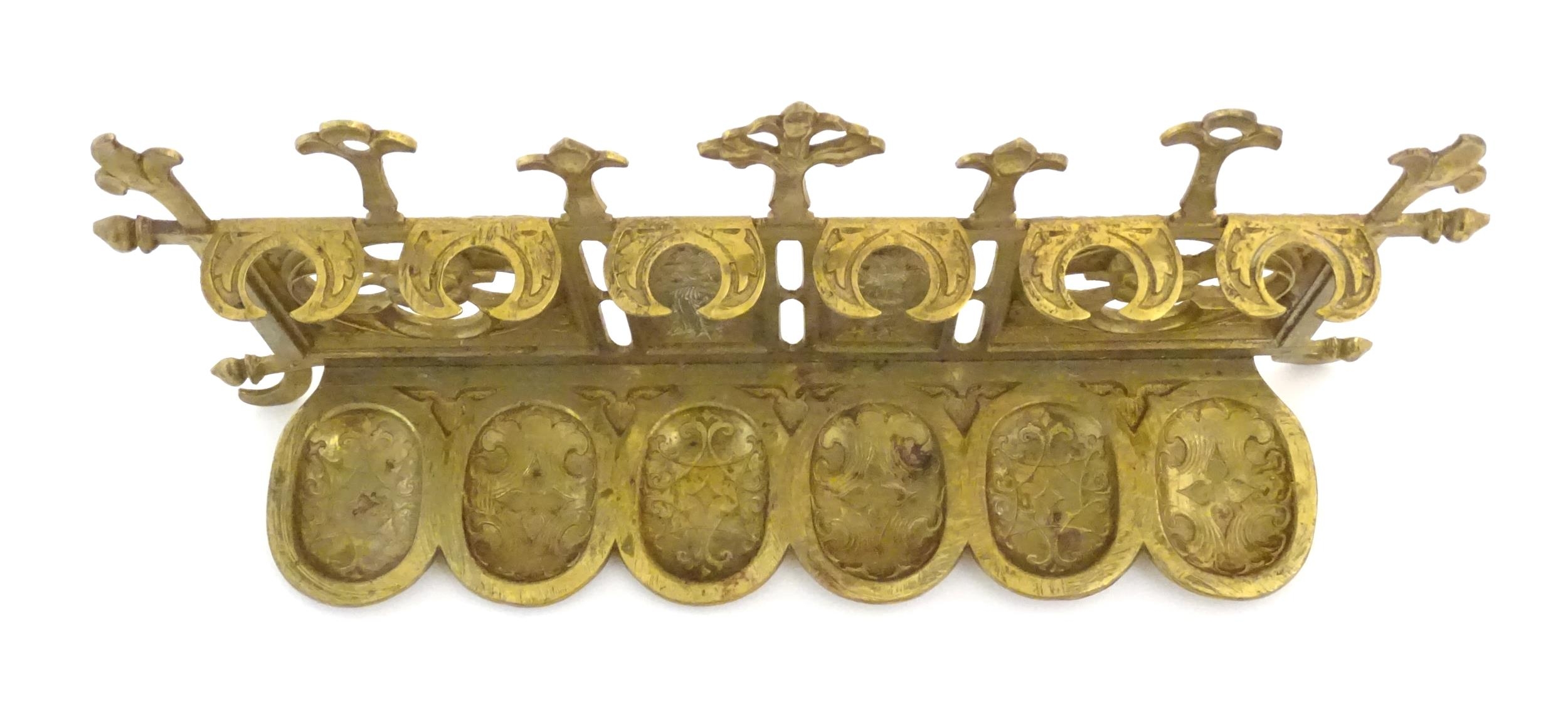 An early 20thC cast brass pipe rack with provision for 6 pipes with Gothic style decoration, pierced - Image 6 of 7