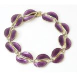 Scandinavian jewellery: A Norwegian silver bracelet with purple guilloche enamel leaf detail,