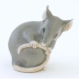 A Bing & Grondahl model of a mouse, no. 1801. Marked under. Approx. 1 3/4" high Please Note - we
