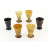Six 19thC miniature carved horn tot cups, the largest 2 3/8" tall (6) Please Note - we do not make