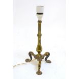 An early to mid 20thC Pullman table lamp, of brass construction with tripod base, standing 12 1/2"
