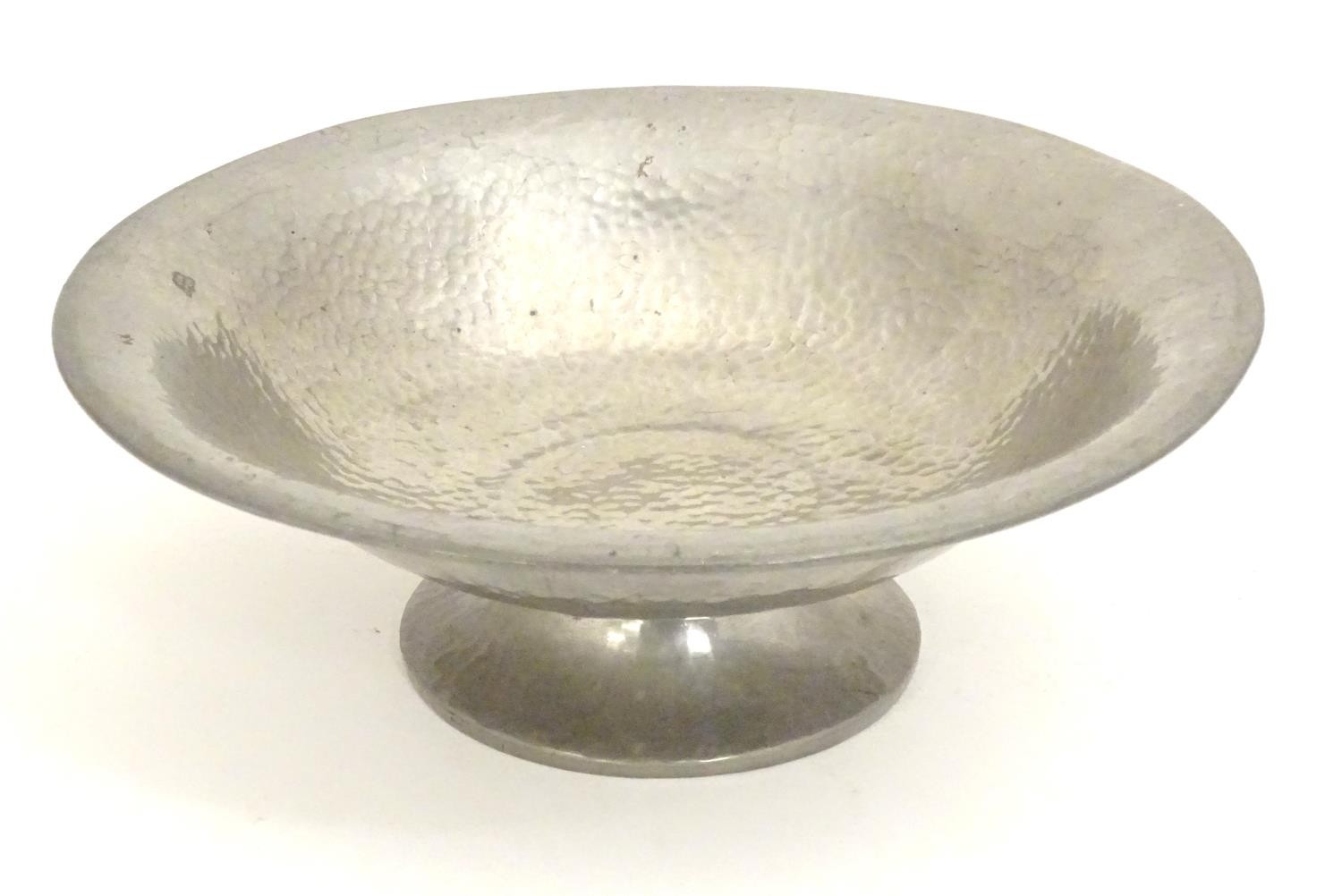 An Arts and Crafts Tudric Pewter pedestal bowl with hammered decoration. Stamped under. Approx. 3