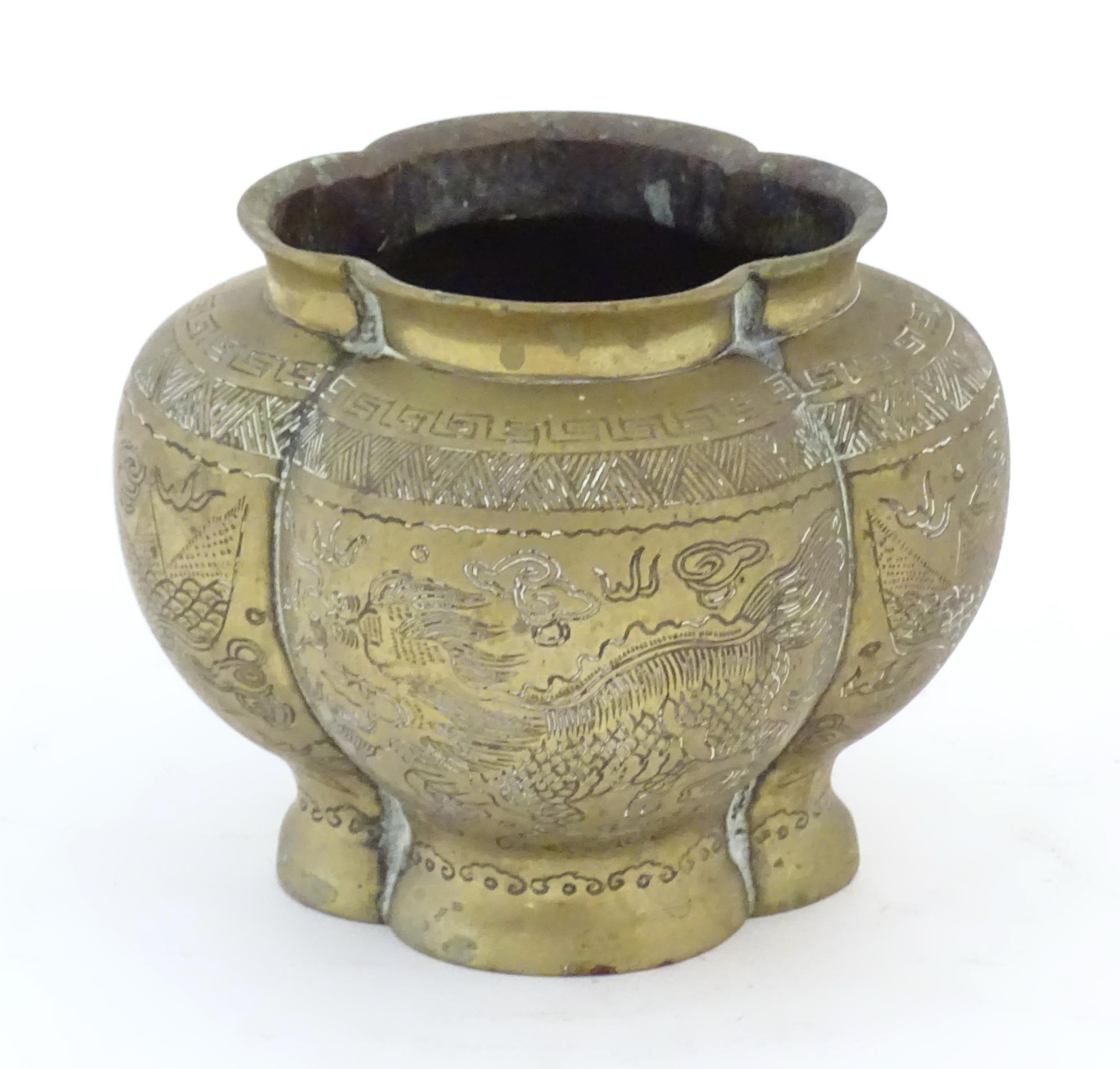 A Chinese brass lobed pot decorated with dragons, phoenix birds and pagoda buildings. Character - Image 4 of 7