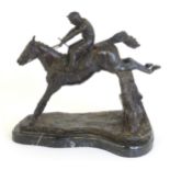 A 20thC cast sculpture after David Geenty's Clearing The Last, depicting horse & jockey, on a marble