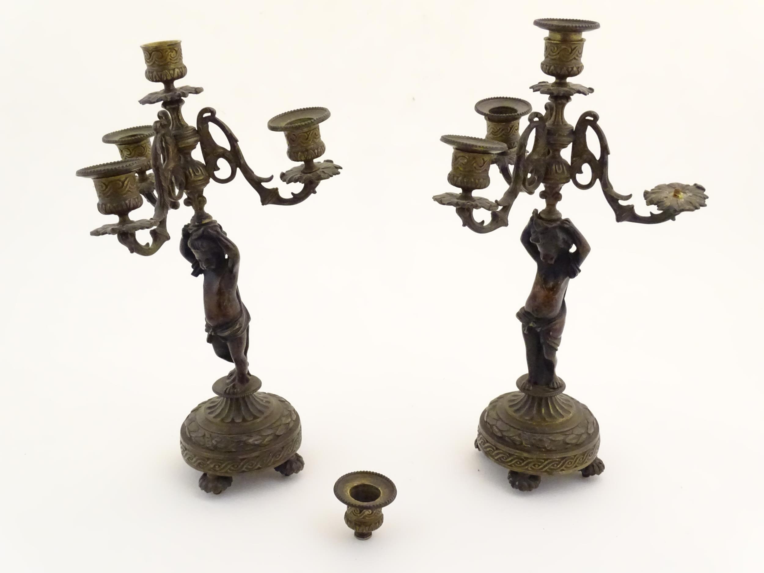 Two 19thC cast metal table candelabra / candelabrum the central bronze columns form as cherubs - Image 10 of 12