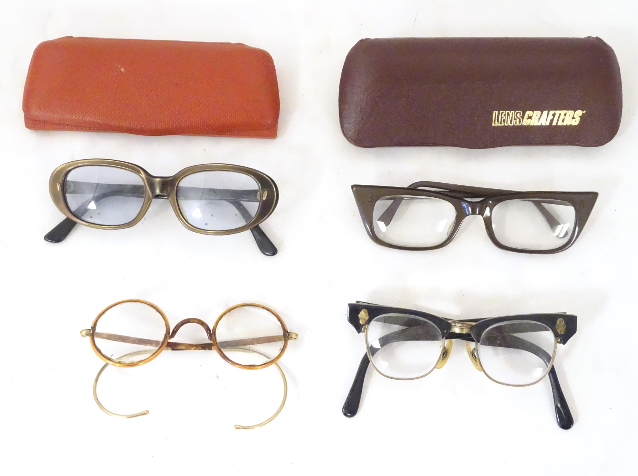 Four pairs of mid 20thC spectacles / glasses, the largest 5 1/4" wide (4) Please Note - we do not