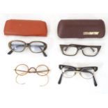 Four pairs of mid 20thC spectacles / glasses, the largest 5 1/4" wide (4) Please Note - we do not