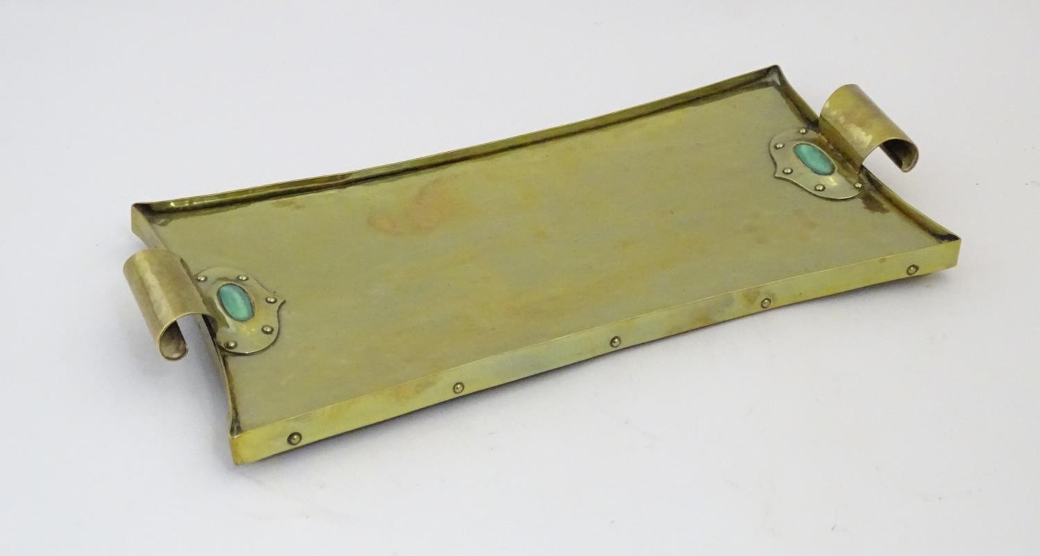 An Arts & Crafts brass tray with twin scroll handles and Ruskin style cabochon and rivet detail. - Image 5 of 9