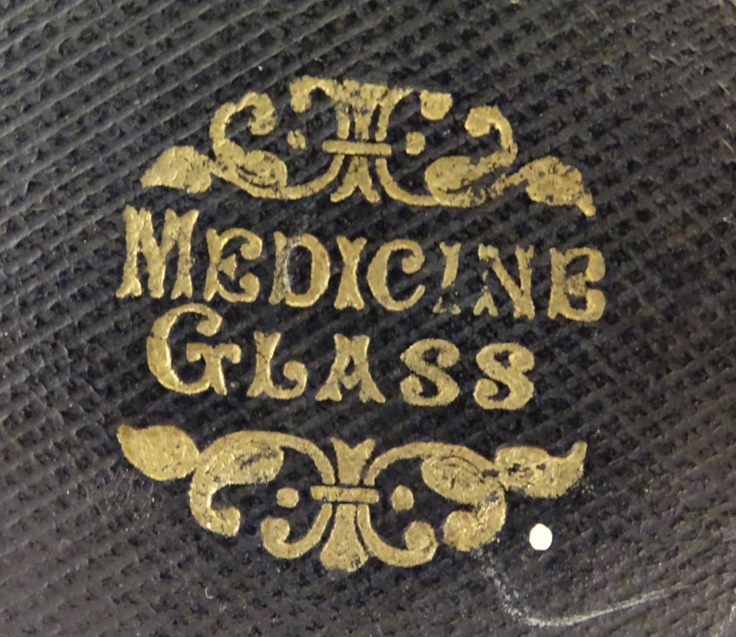 A 19thC medicine measuring glass, in a fitted cylindrical leather case Please Note - we do not - Image 6 of 8