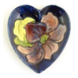 A Moorcroft dish of heart form decorated in the Clematis pattern. Marked under. Approx. 5" x 4 1/