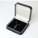 A 9ct gold pendant and chain, the pendant set with blue spinel. Pendant approx. 1" long, chain