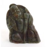 A Chinese carved jade figure depicting a man holding a fan and a staff. Approx. 6 1/4" high Please