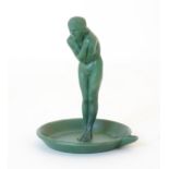 A French Art Deco green patinated metalware dish with central female nude, designed by Max Le