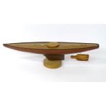 Toy: A 20thC wooden model of a pond yacht / boat with inlaid boxwood deck. Approx. 48 1/2" long